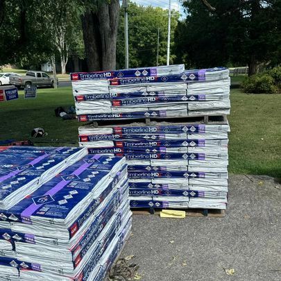 A bunch of boxes stacked on top of each other on a pallet