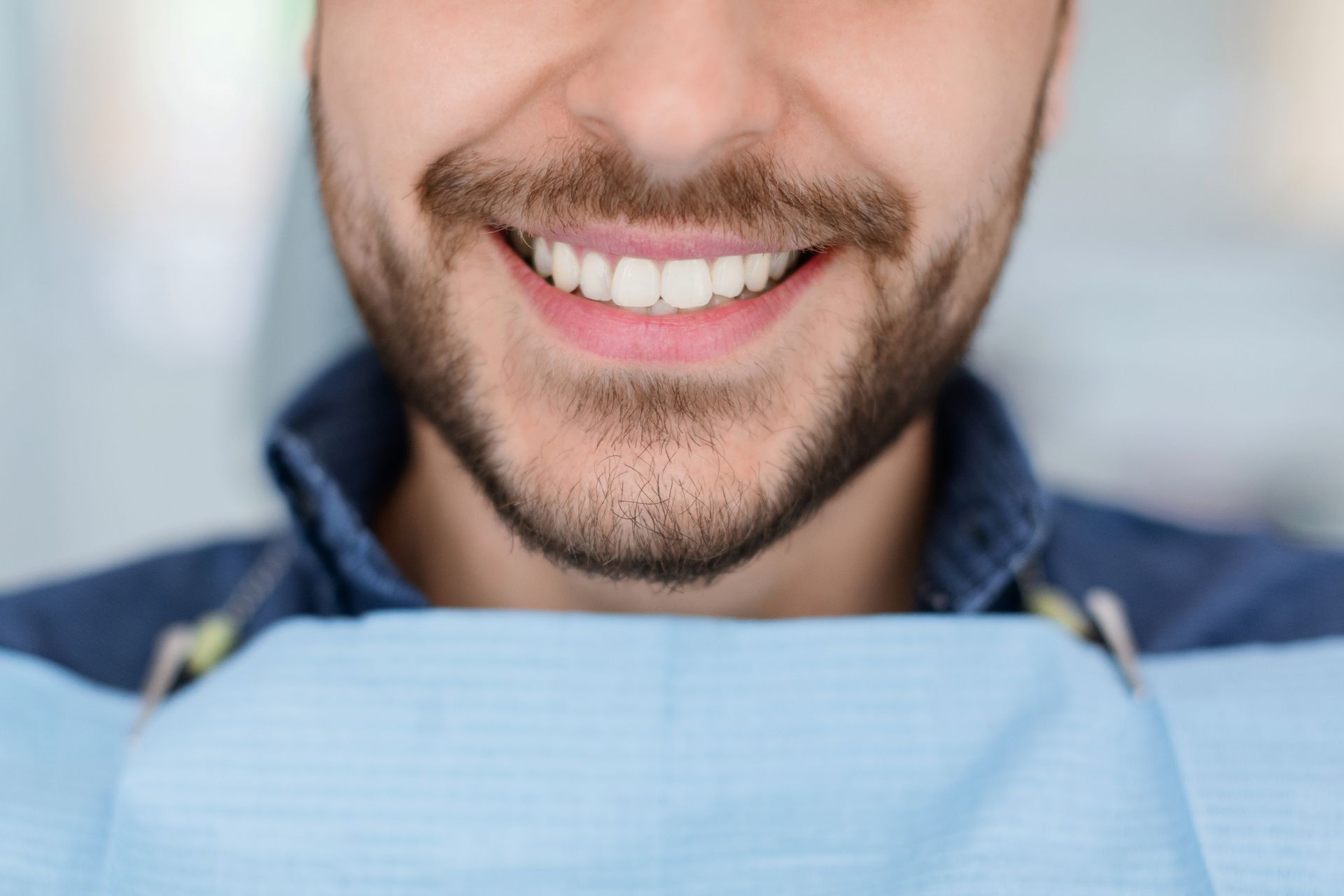 closeup of man dental clinic patient white healthy tooth implant