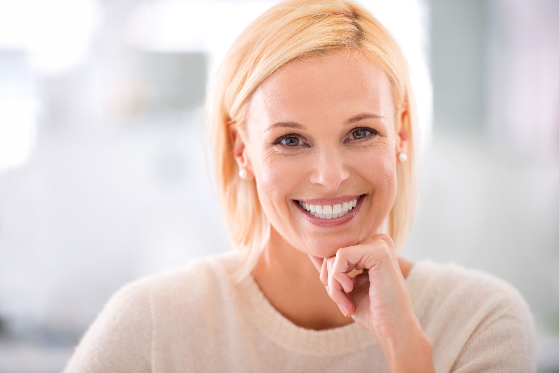 portrait of an attractive young businesswoman with a nice set of teeth wth dental implants