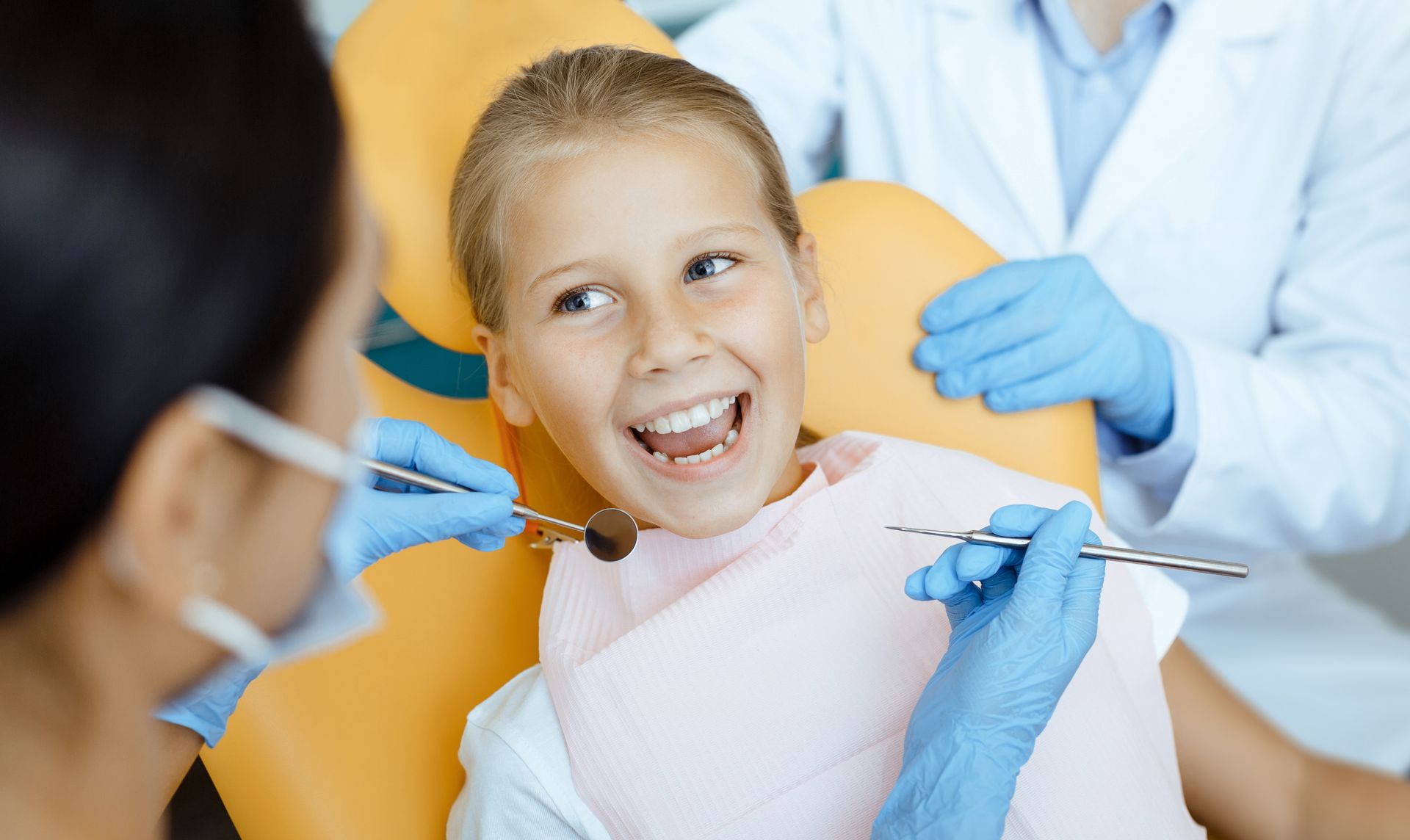 Kid opening mouth at dentist for a check up in Toowoomba