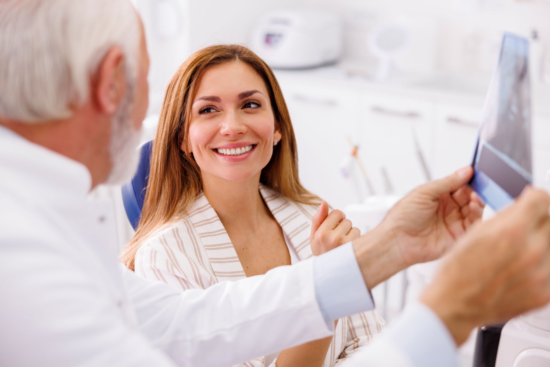 Dentist and patient looking at teeth scan