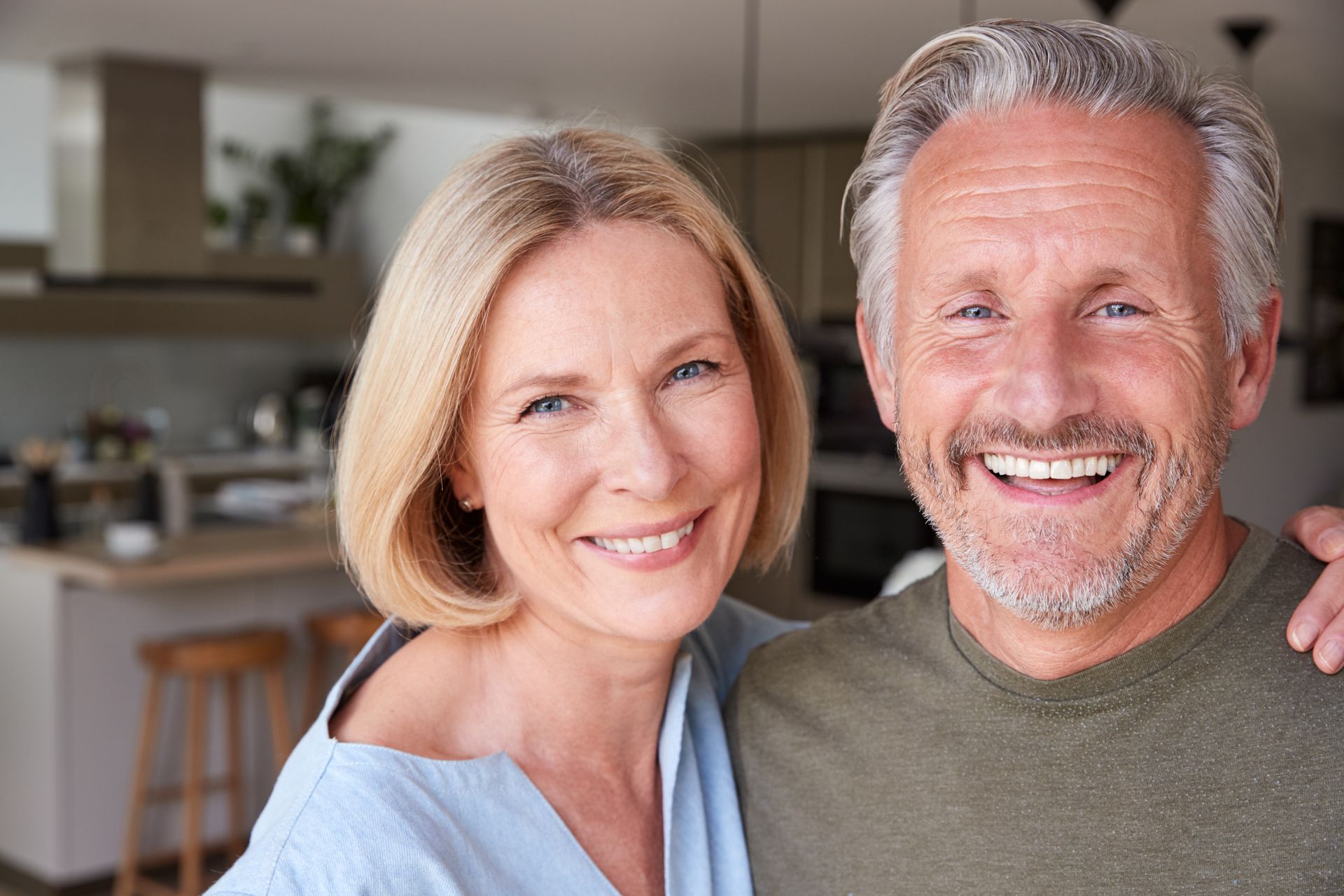 Happy mature couple smiling confidently after dental implants treatment in Toowoomba