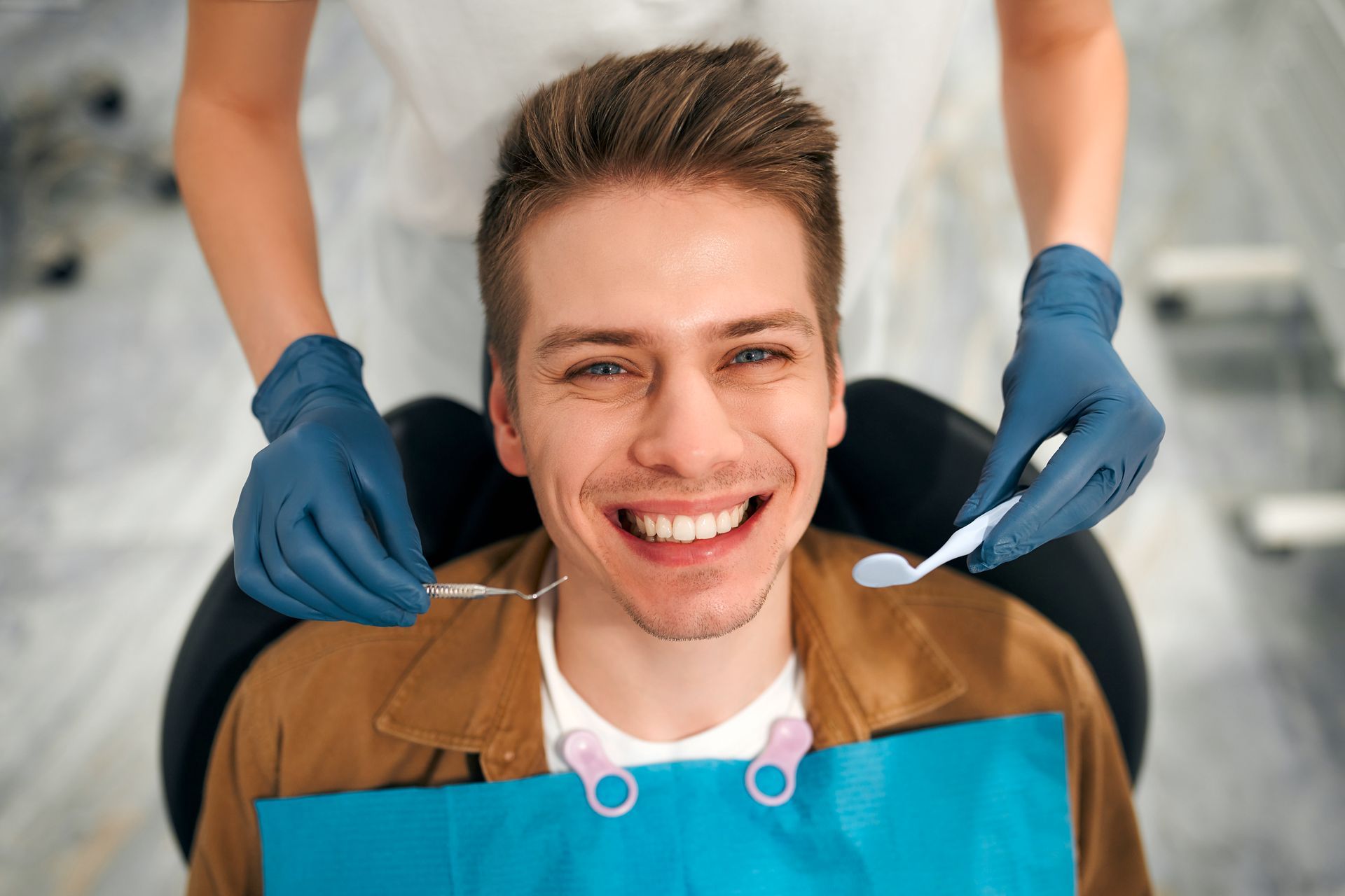 Patient undergoing a dental examination to assess whether a damaged tooth can be saved