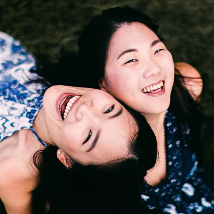 women smiling after dental treatment