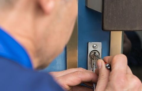 Man Fixing The Lock Door — Lock Services in St Peters, MO
