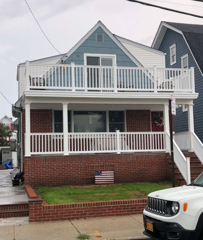A house with a lot of windows is being remodeled
