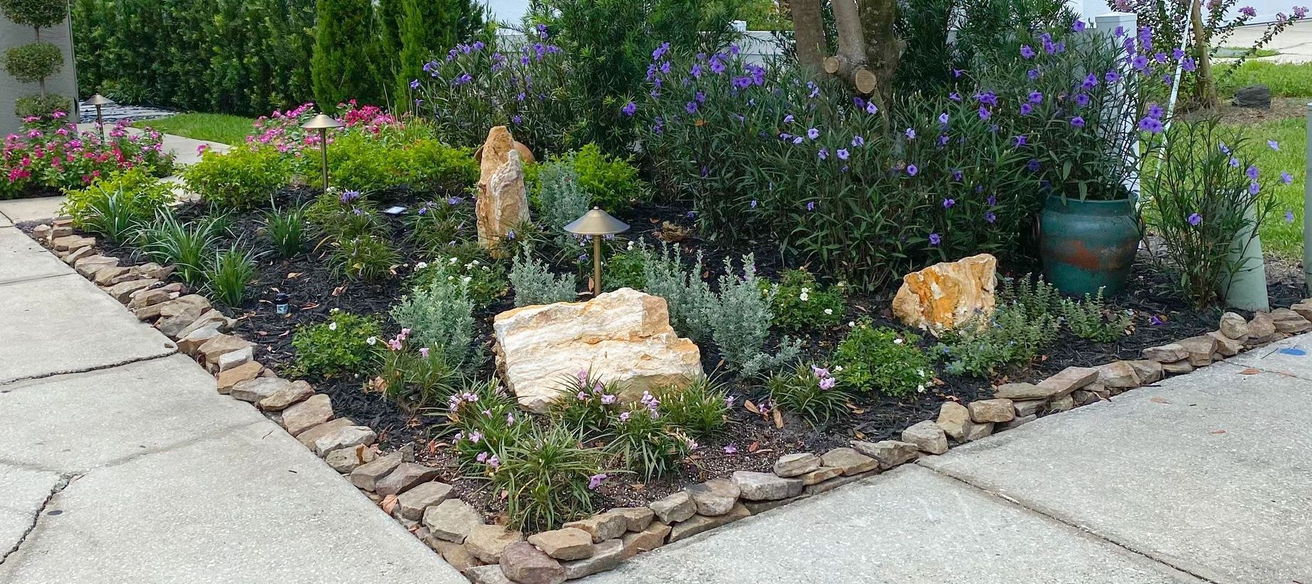 there is a bench in the middle of a lush green garden .