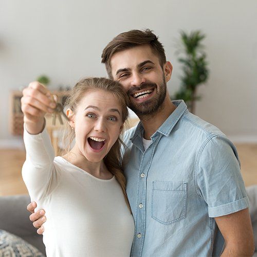 Couple Standing in Living Room — Cape Coral, FL — Ordonez Realty