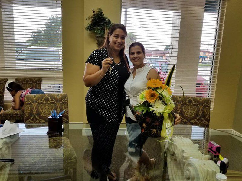 Two Women Smiling Together — Cape Coral, FL — Ordonez Realty