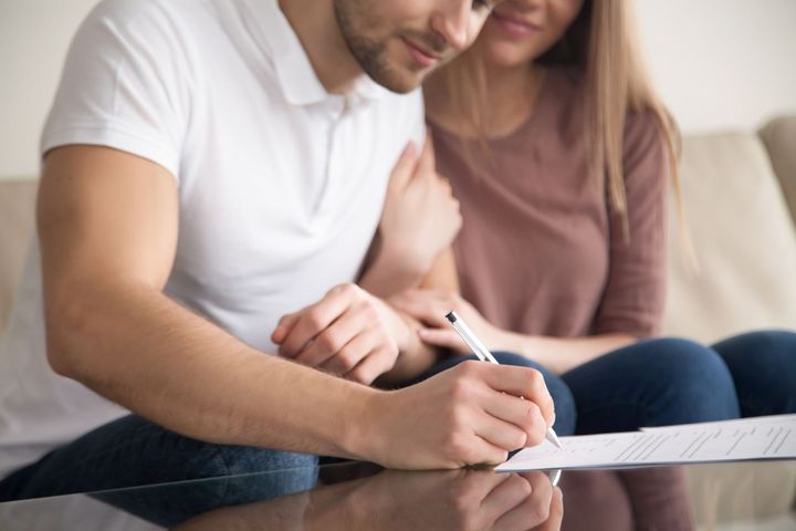 Man signing document