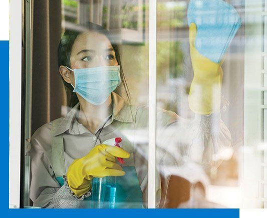 Woman Cleaning Window — Lafayette, LA — Fuselier's Janitorial Service, Supplies & Rentals