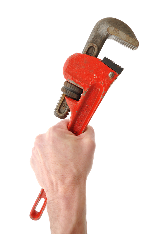 A hand is holding a red pipe wrench on a white background A hand is holding a red pipe wrench on a white background