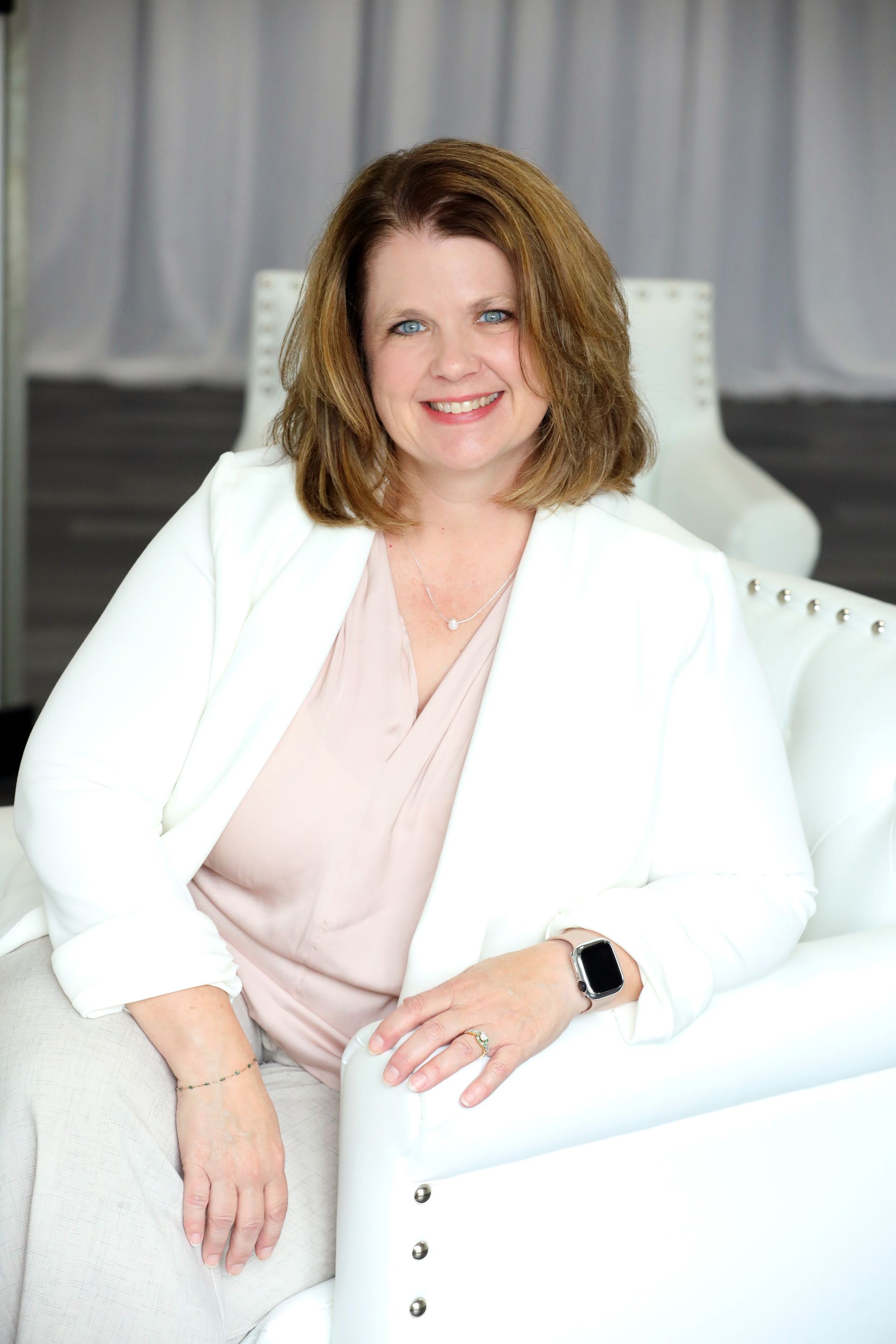 A group of people posing for a picture in front of a christmas tree