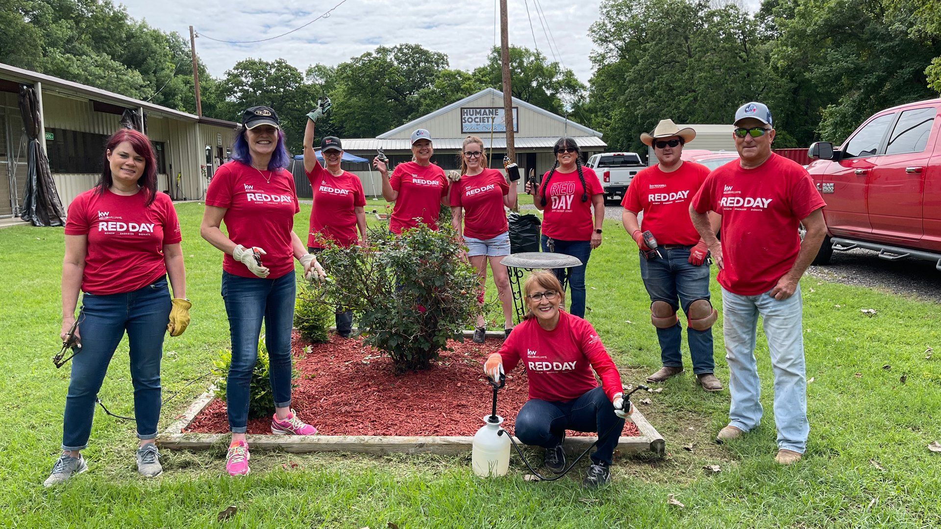 Shared Vision Realty team planting a tree in the community