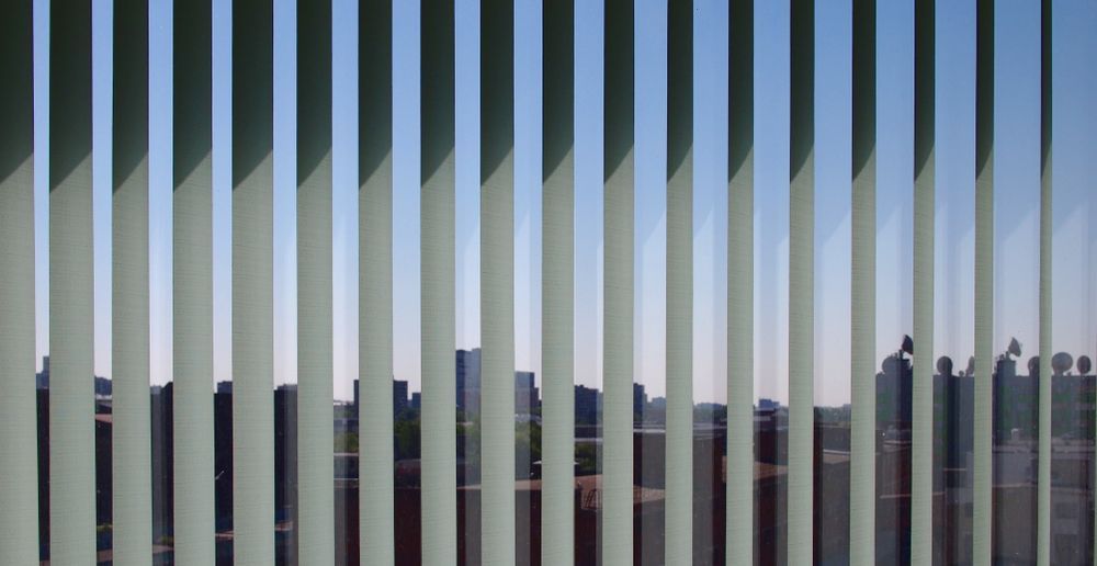 Vertical Blinds Framing a Distant Landscape — Curtain Concepts in Dunbible, NSW