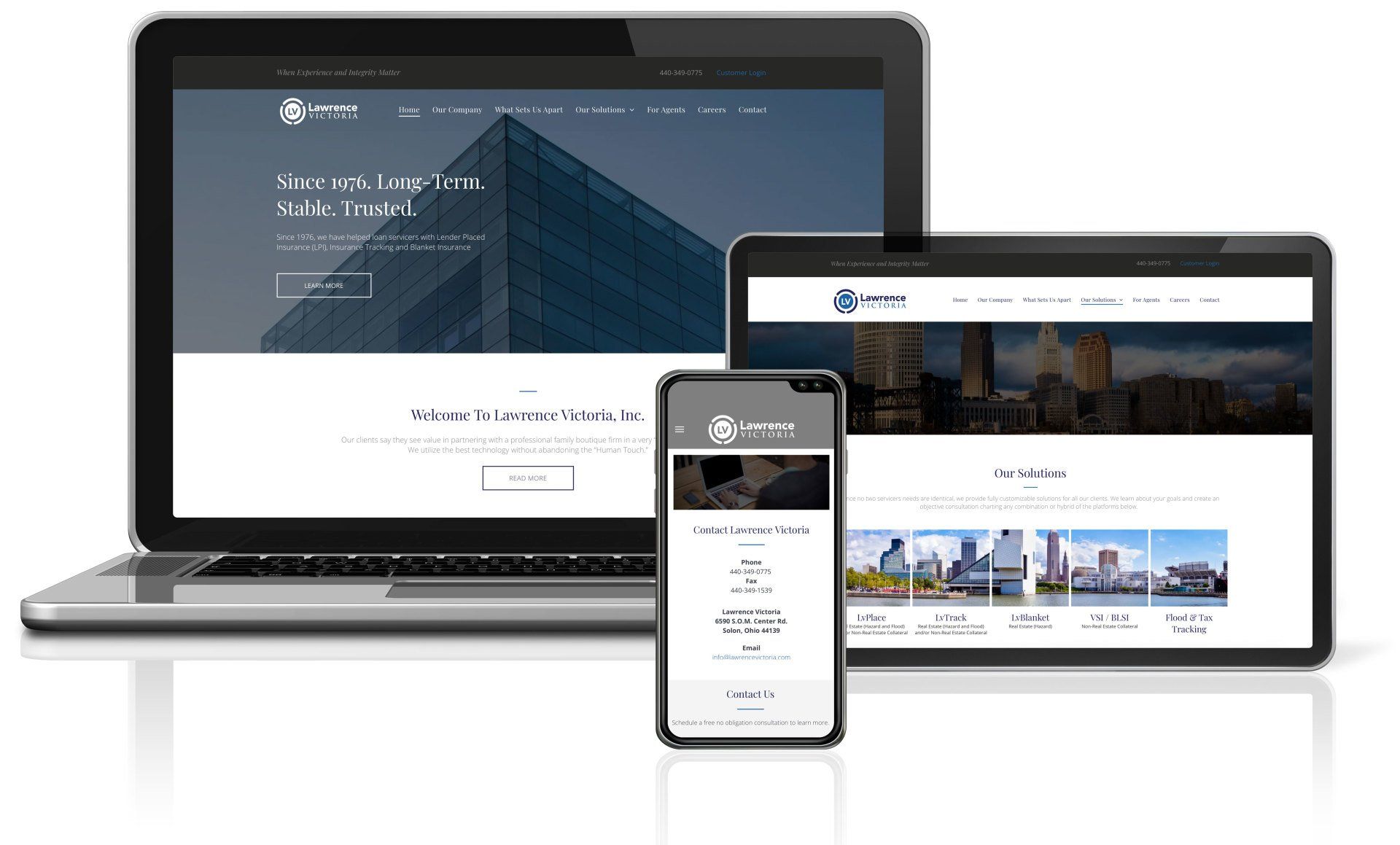 Laptop, tablet, and smartphone displaying a website on various devices.