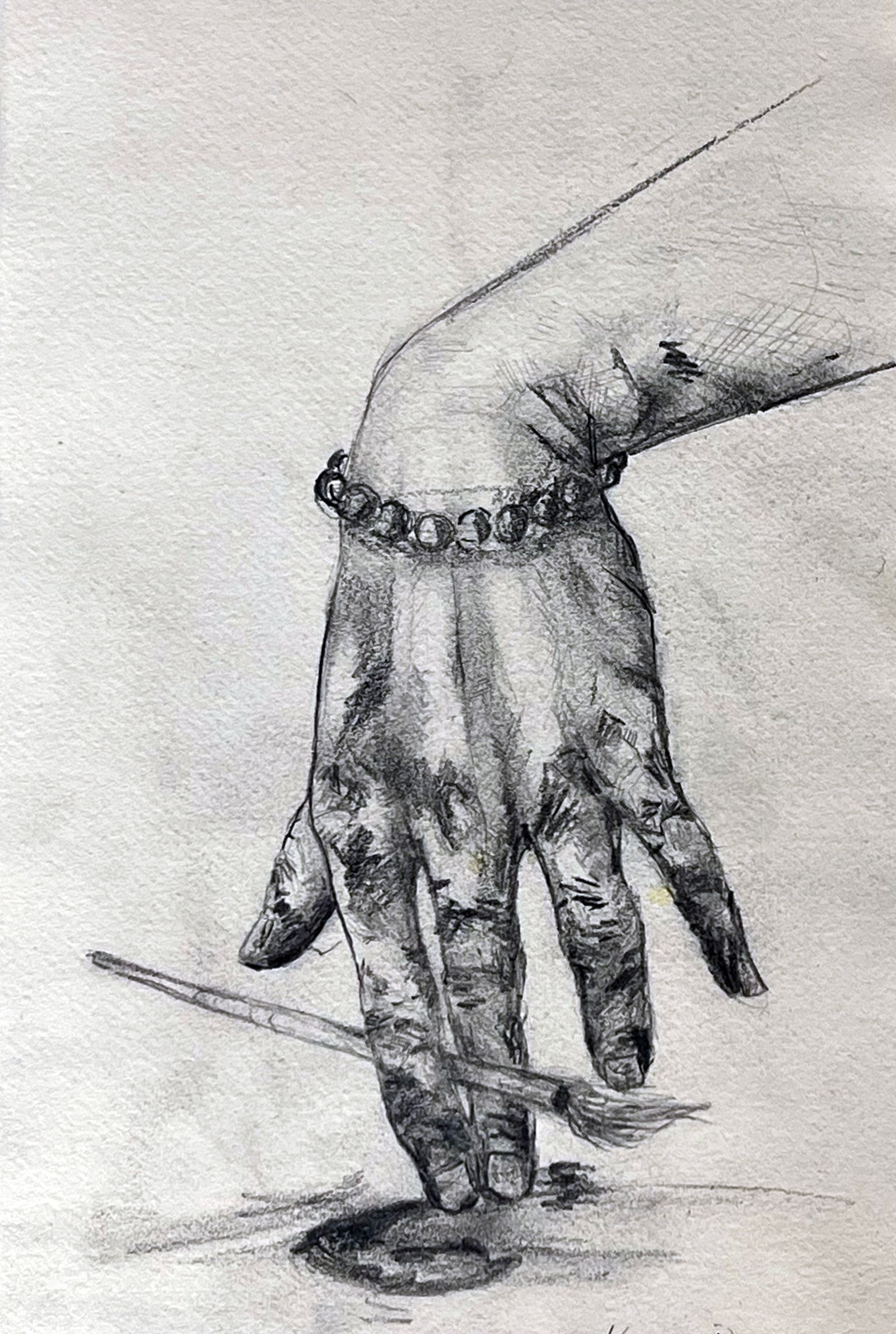 An image of a hand and wrist holding a  paintbrush - part of a selection of  BRISTOL 1904 ARTS evening sketches painted on the night of our regular Wednesday evening concert programs.