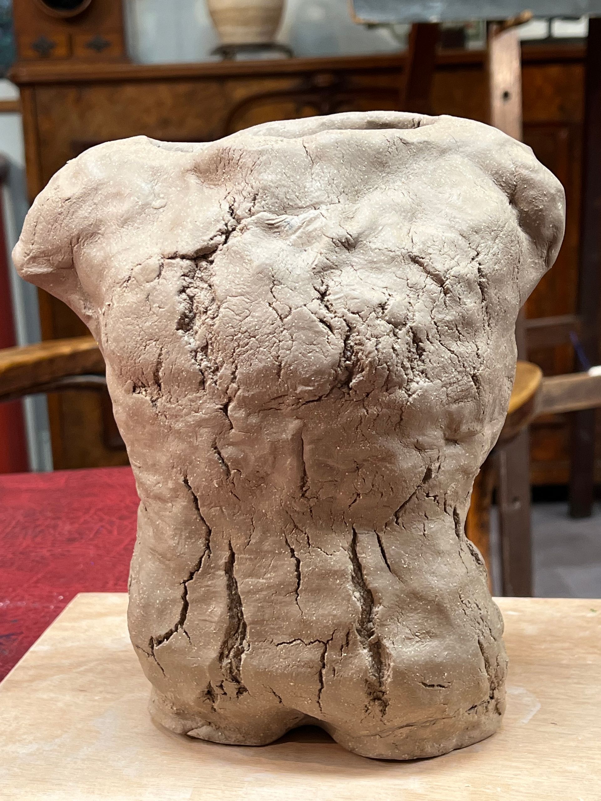 A clay male torso sculpture  - part of a selection of  BRISTOL 1904 ARTS evening artworks on the night of our regular Wednesday evening concert programs.
