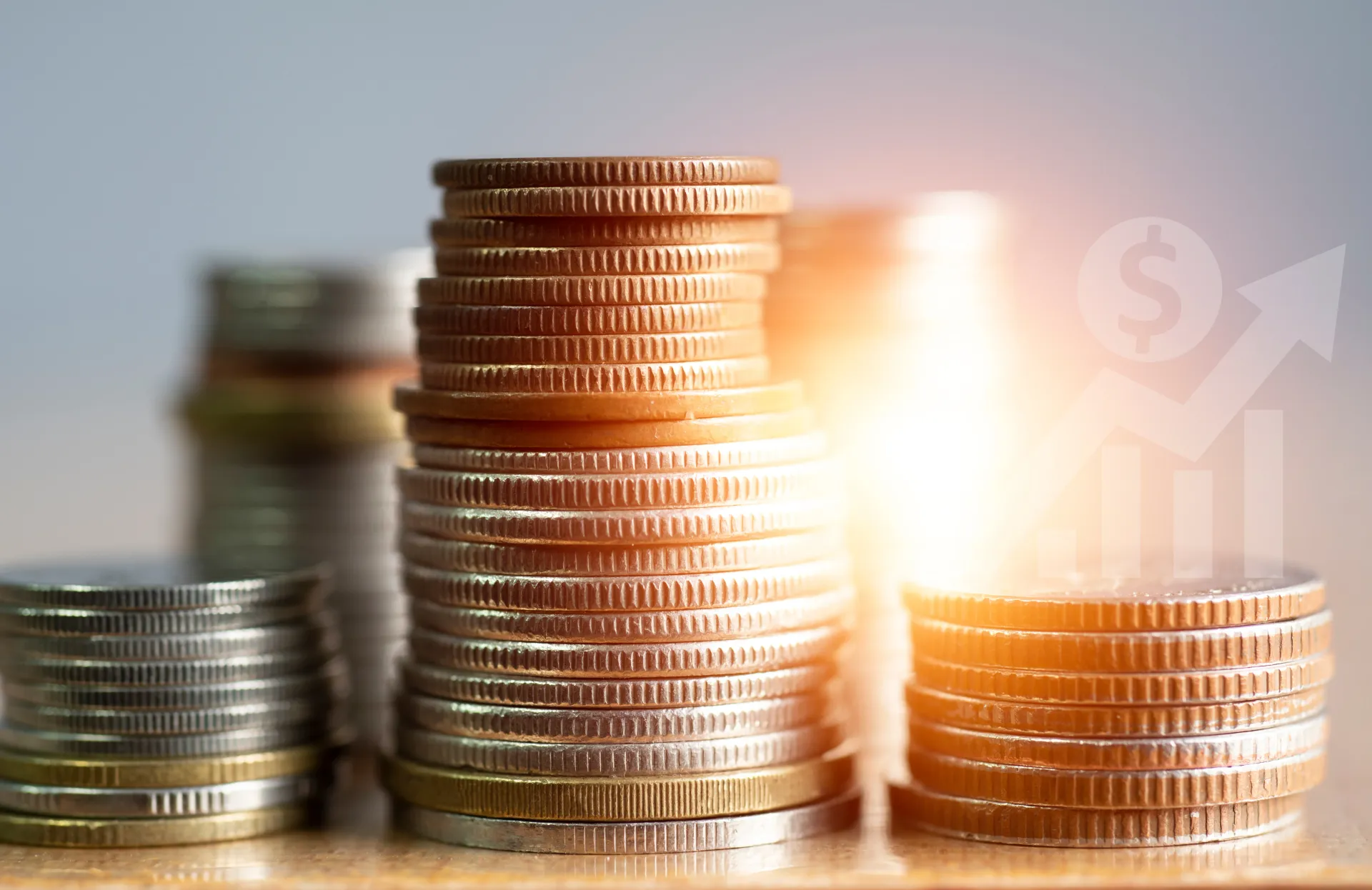 A stack of coins sitting on top of each other on a table.