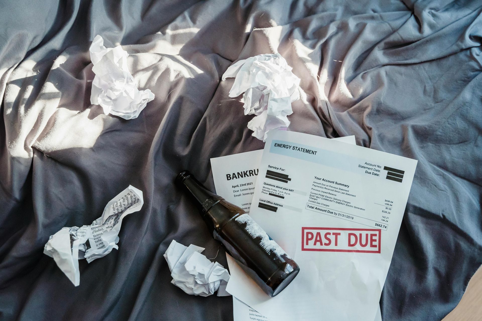 A stapler is sitting on top of a piece of paper that says past due.