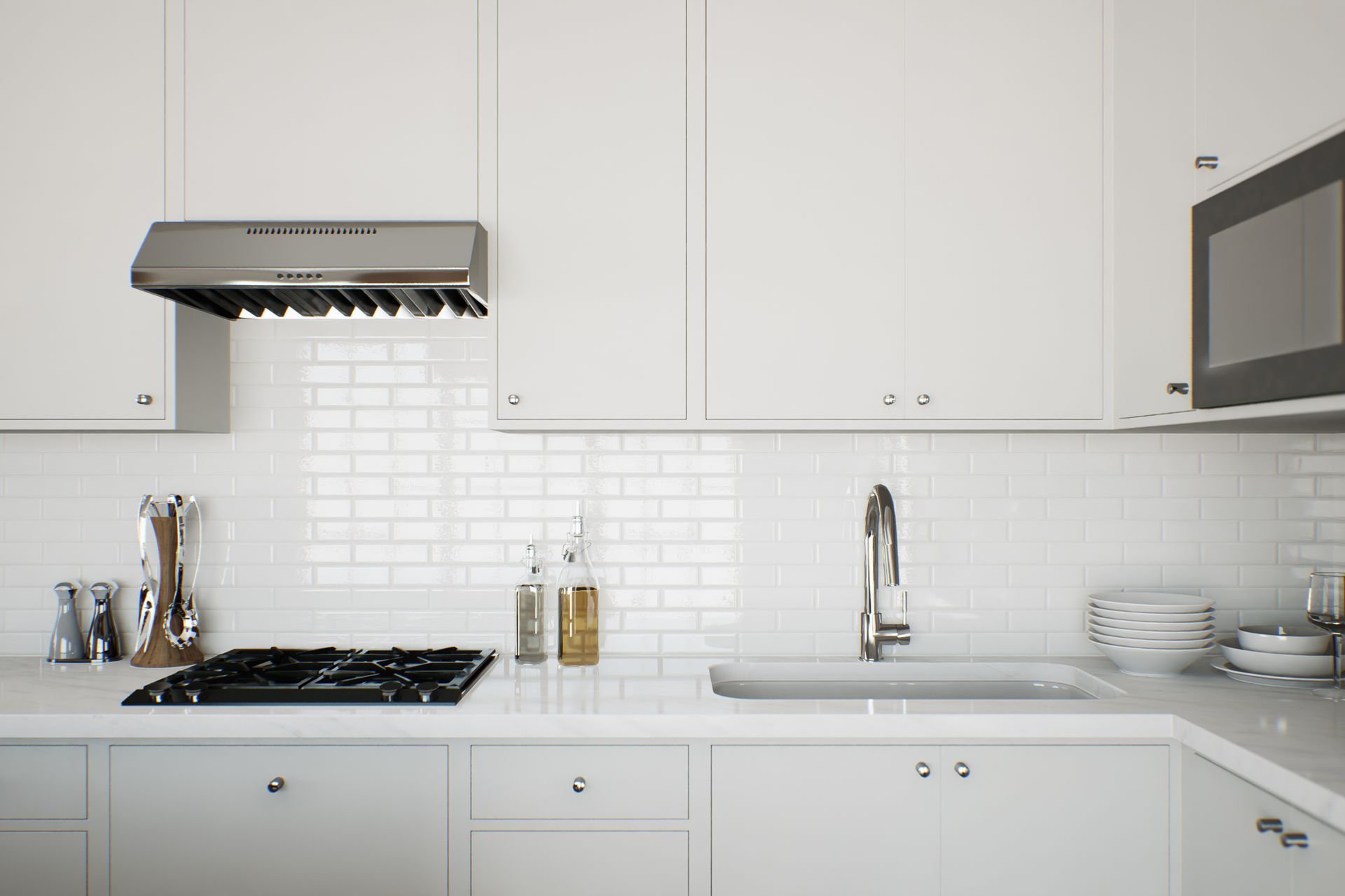 A kitchen with white cabinets , a sink , a stove , and a microwave.