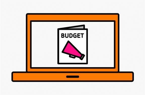 orange laptop with an image of a budget book