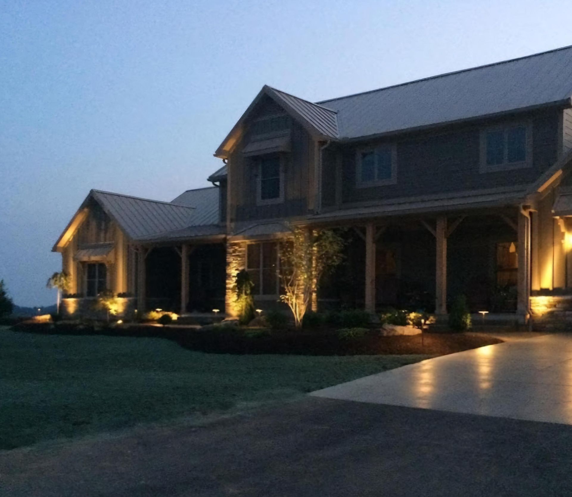 A large house is lit up at night