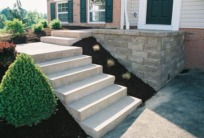 A set of concrete steps leading up to a house