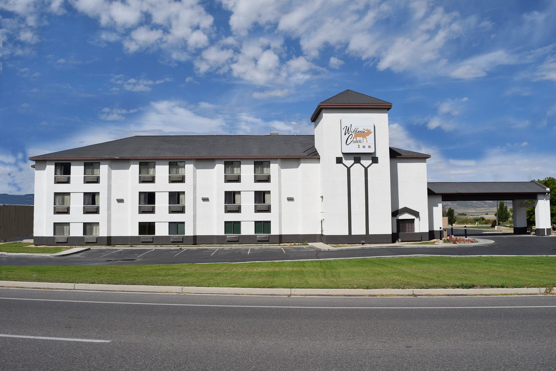 A large white building with a clock on top of it