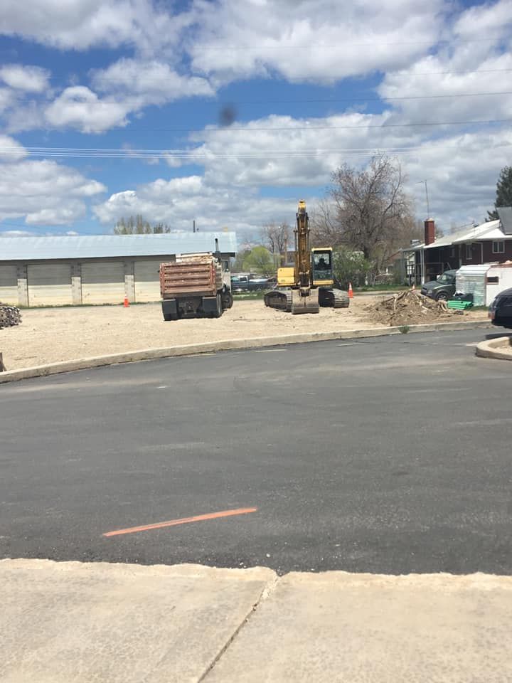 A construction site with a truck and a bulldozer
