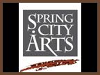 A logo for spring city arts with a feather in the middle.
