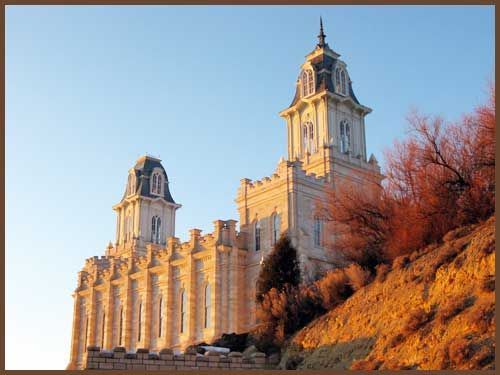 A large building is sitting on top of a hill.