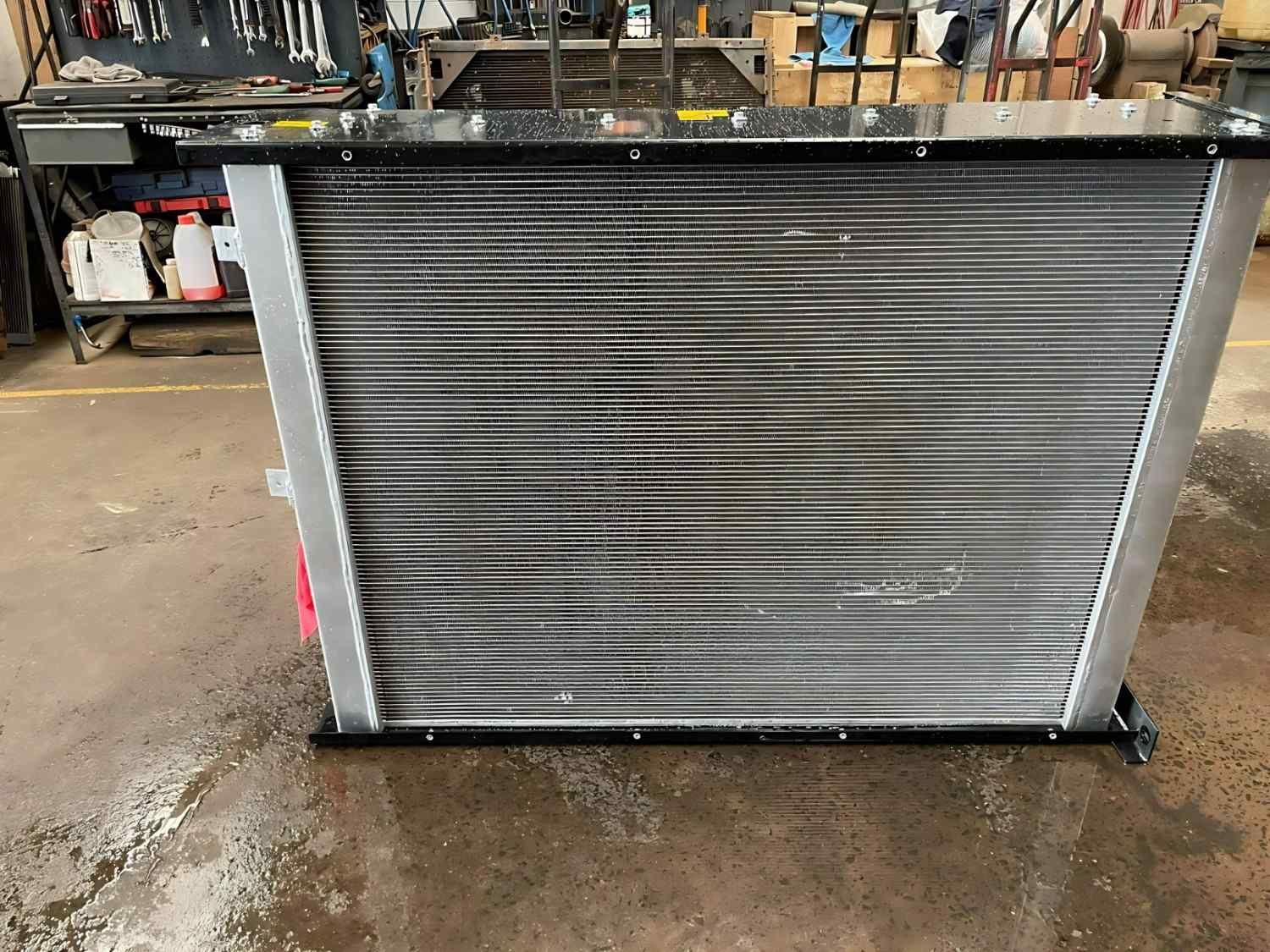 A Radiator is Sitting on the Ground in a Garage — Neilsen's Radiator Service in Toowoomba City, QLD