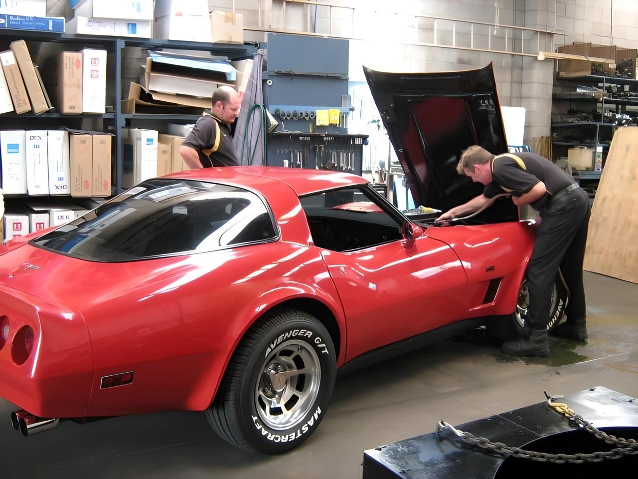 Two Men Are Working on a Red Corvette With the Hood Up — Neilsen's Radiator Service in Toowoomba City, QLD
