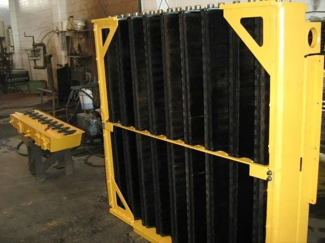A Yellow and Black Radiator is Sitting in a Room — Neilsen's Radiator Service in Dalby, QLD