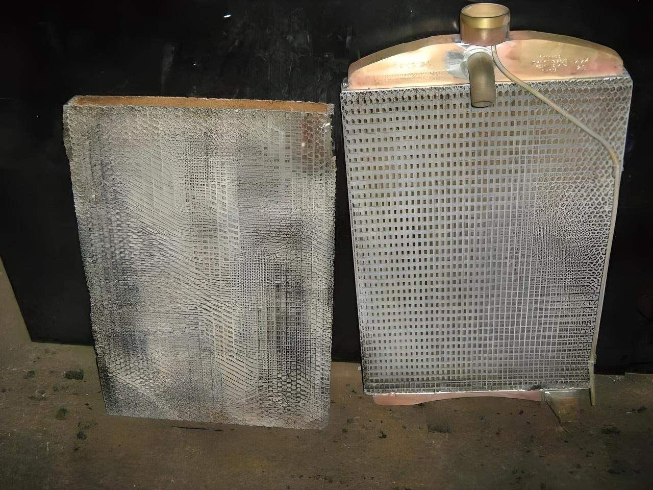 Two Radiators Are Sitting Next to Each Other on a Table — Neilsen's Radiator Service in Warwick, QLD