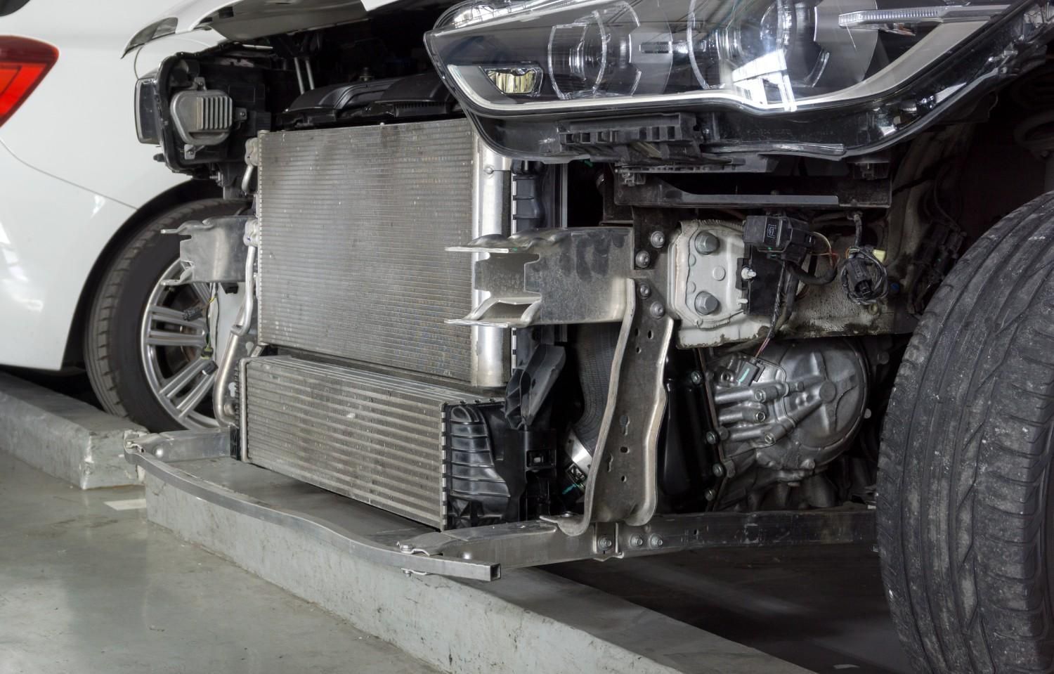 A White Car With the Front End Removed is Parked in a Garage — Neilsen's Radiator Service in Toowoomba City, QLD