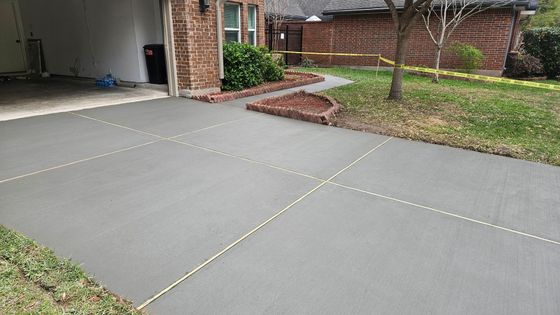 A Coquitlam home showing a concrete driveway