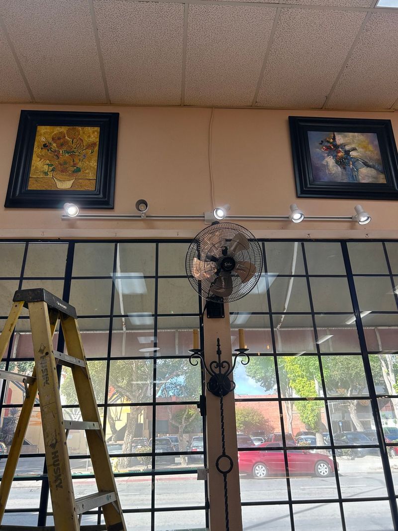 White ceiling with track lighting fixtures.