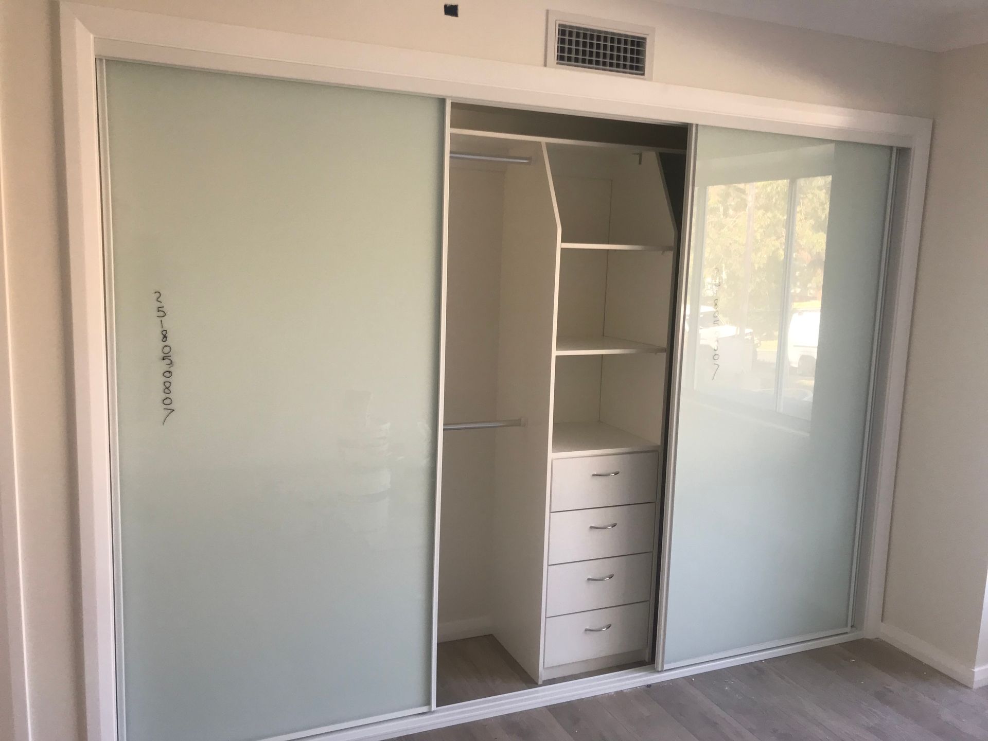 Person Inspecting Window Well, Writing on Clipboard Outdoors — Keystone Property Solutions In Maitland, NSW