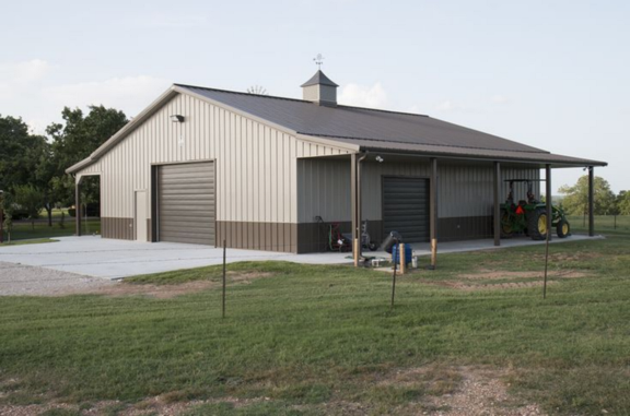 A large building with a tractor parked in front of it
