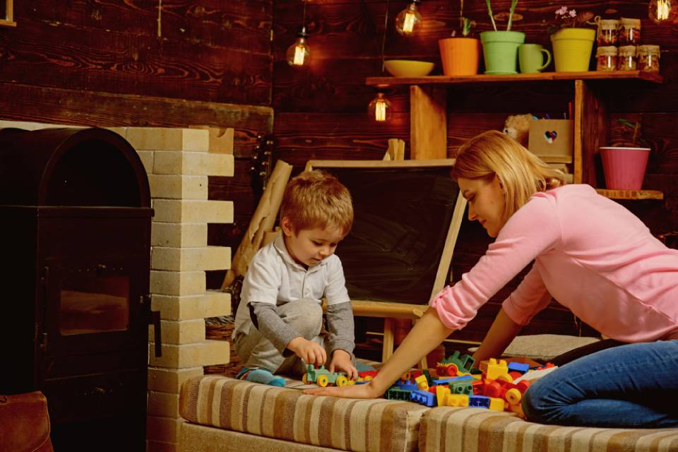 mother and  son playing with building blocks