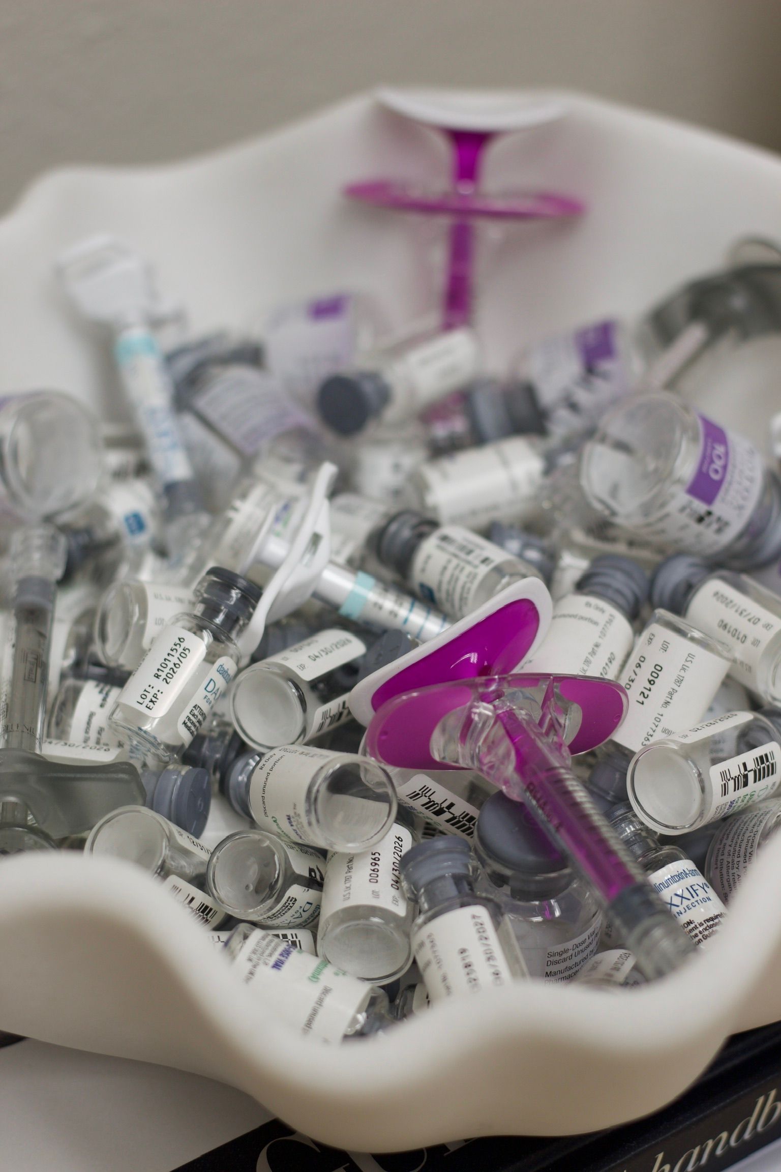 A woman is taking a selfie in front of a mirror.