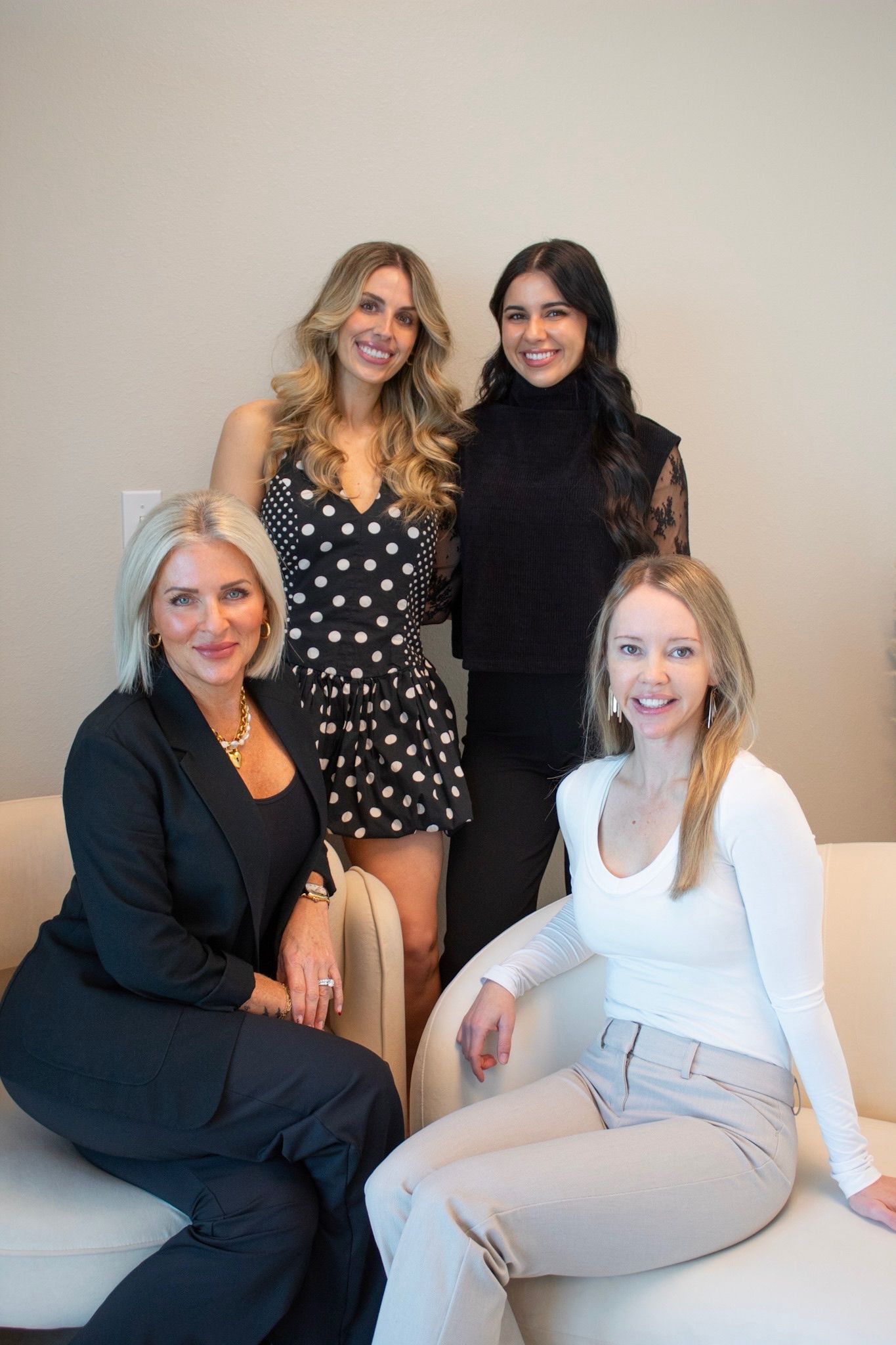 A group of women are posing for a picture together.