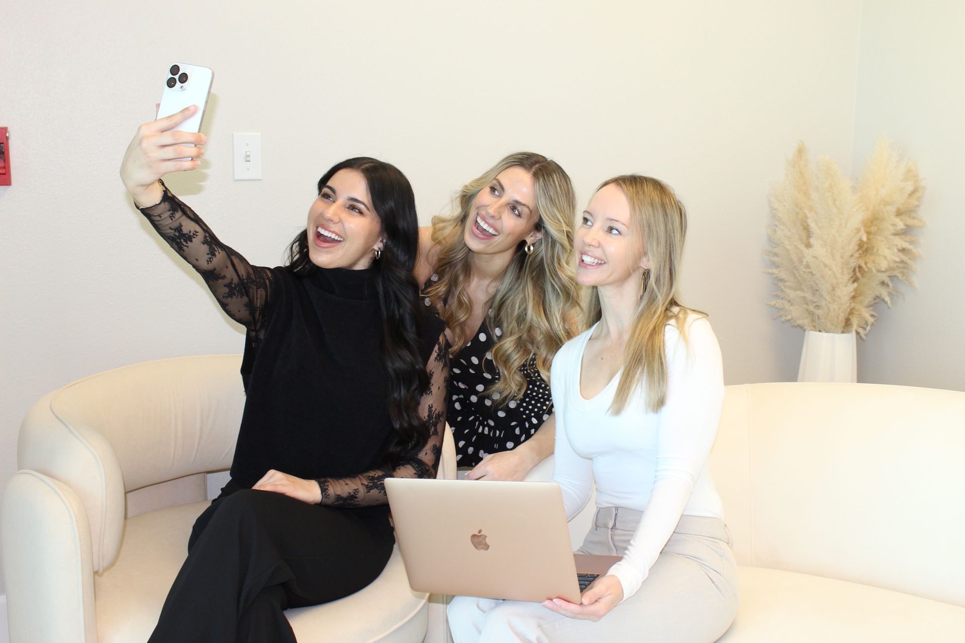 A group of women are posing for a picture together.