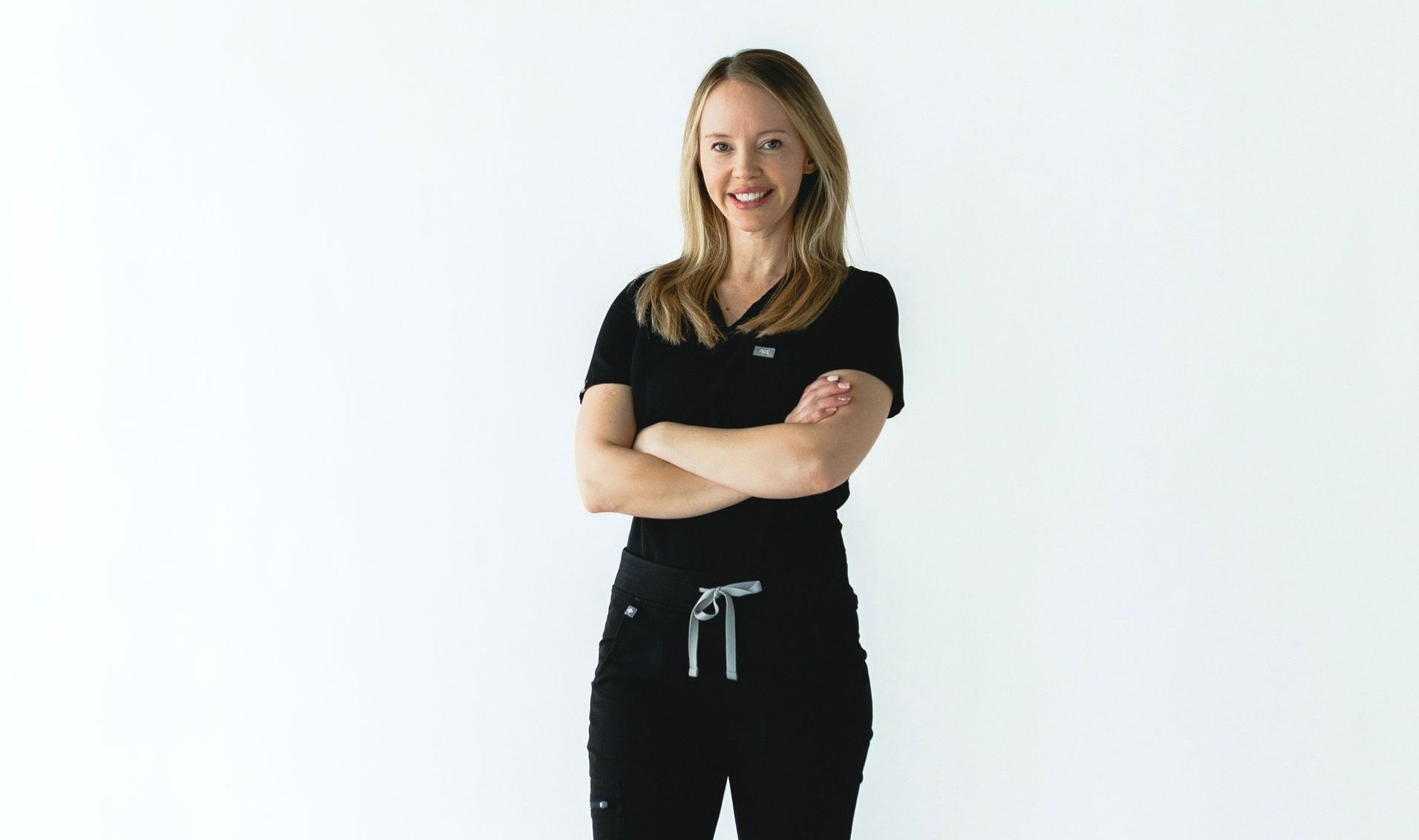 A group of women are posing for a picture together.