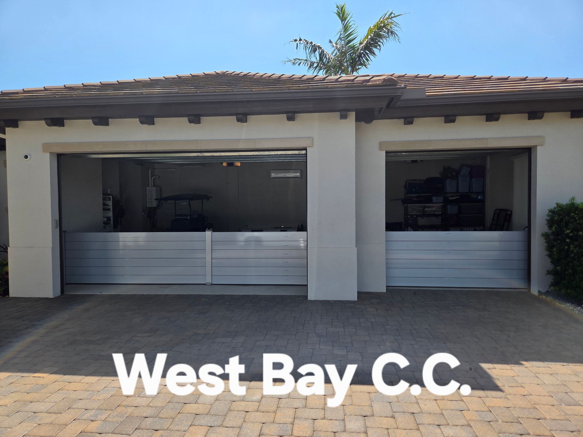 A picture of a garage with the words west bay c.c.