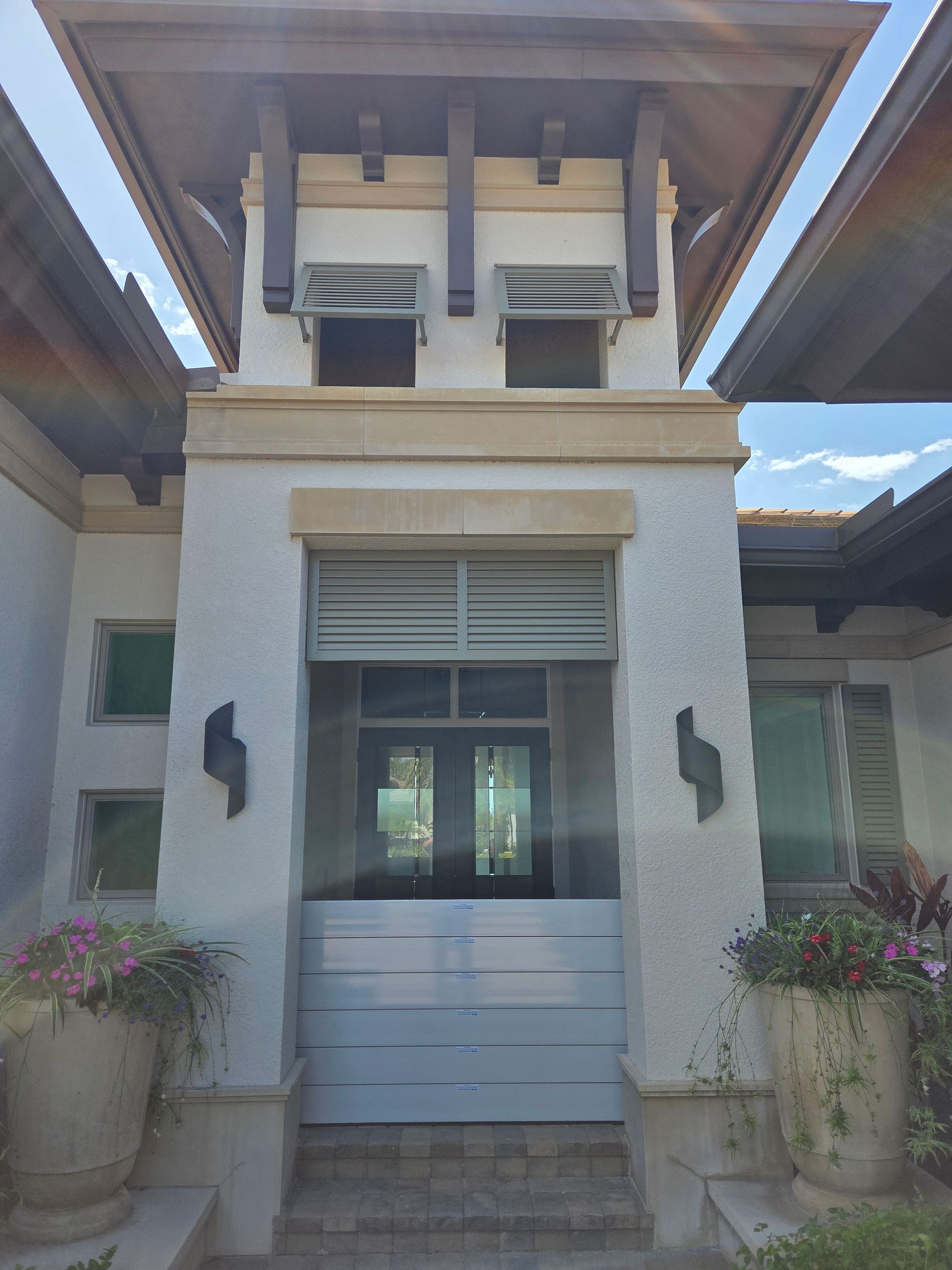 A white building with a s on the side of it