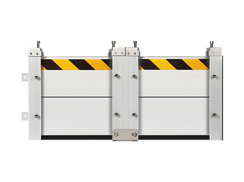 A white barrier with black and yellow stripes on it.