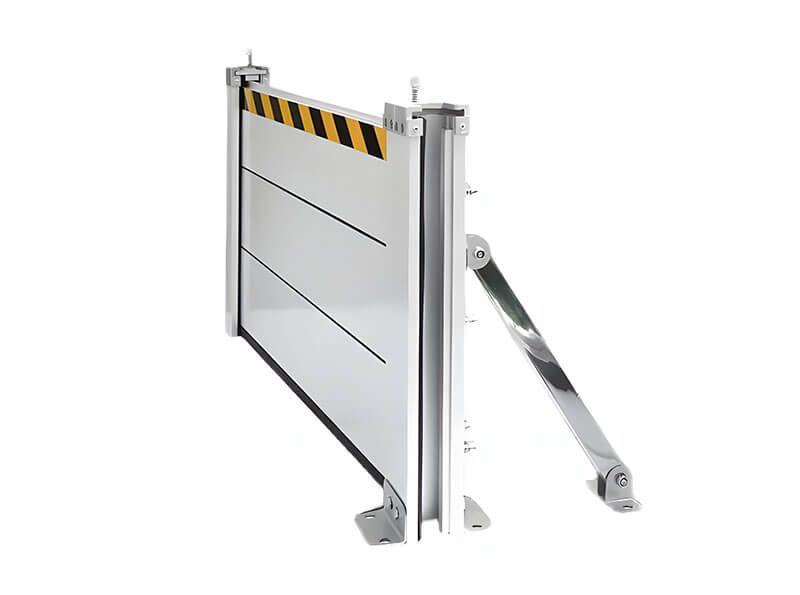 A metal barrier with yellow and black stripes on it is sitting on a white surface.